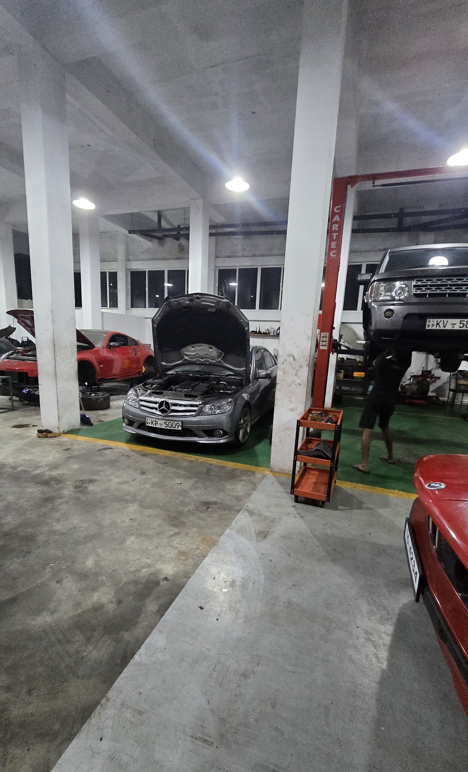 Auto Medic workshop service bay with vehicles